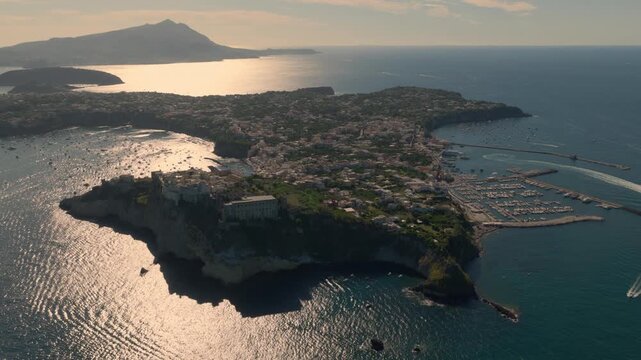 Island Of Procida At Sunset Off The Coast Of Naples In Southern Italy. Aerial Drone Shot