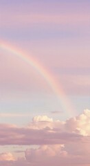 Naklejka premium Rainbow's Embrace: Witness the ethereal beauty of a full rainbow arching across a pastel sky, a symbol of hope and serenity. Capture the essence of this stunning phenomenon.