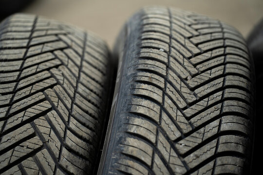 A close-up of the rubber tire treads from a car