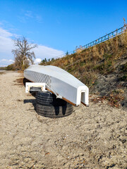 White Boat Resting On Tires