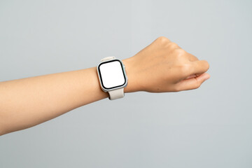 Close Up of a Woman's Hand Wearing a Smart Watch with a White Screen