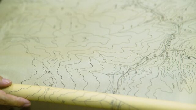 Engineer Reviewing Topographic Map for Construction Planning