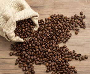 Spread coffee beans create natural organic composition on clean white background.