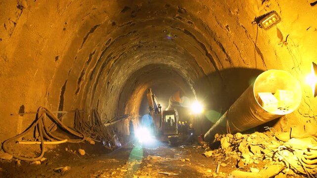 Large Scale Underground Tunnel Construction Site with Industrial Equipment