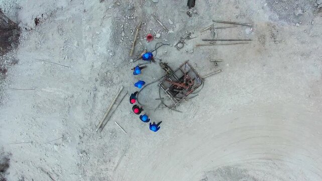 Aerial Construction Site with Workers and Heavy Equipment