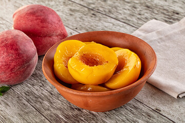 Sweet ripe yellow canned peaches