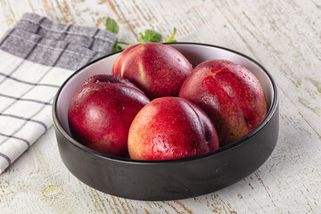 Ripe sweet juicy nectarines heap