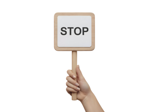 Human hand holding a stop sign displaying the word STOP in bold black letters isolated on transparent background