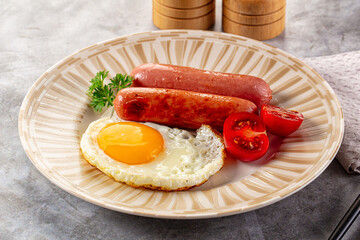 Breakfast with egg and sausages
