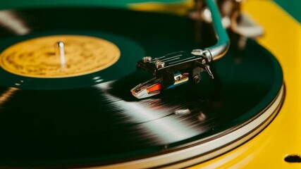 Retro inspired close up of spinning vinyl record on turntable with visible needle and warm bokeh lights delivering nostalgic music themed footage for party memories lifestyle and vintage.