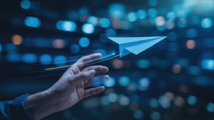 Hand launching digital paper airplane with glowing trail in tech
