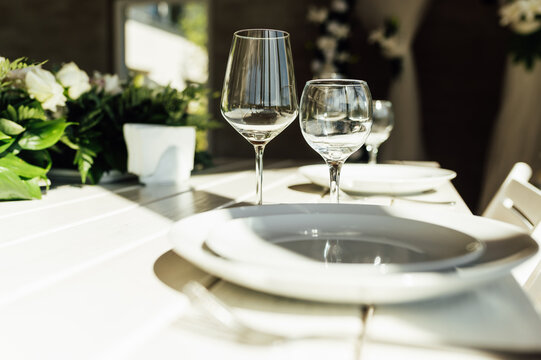 Elegant festive table setting with green decor and glassware - Powered by Adobe