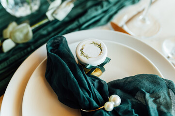Elegant festive table setting with green decor and glassware