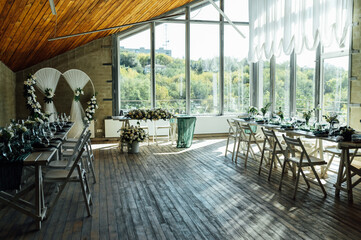 Elegant festive table setting with green decor and glassware