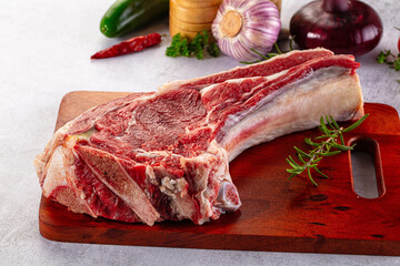 Raw prime beef steak with bone