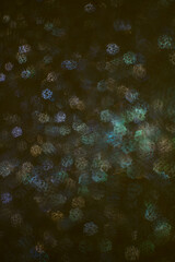 Christmas background. Festive abstract background with bokeh defocused lights and stars