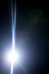 Flash of a distant abstract star. Abstract sun flare. The lens flare is subject to digital...