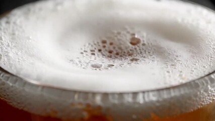 CloseUp of a Refreshing Craft Beer with a Thick Creamy Head A Visual Exploration of Texture and Taste Perfect for Summer Advertising and Bar Promotions.