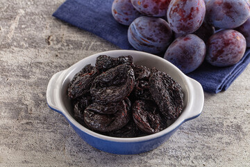 Black dry sweet prunes heap