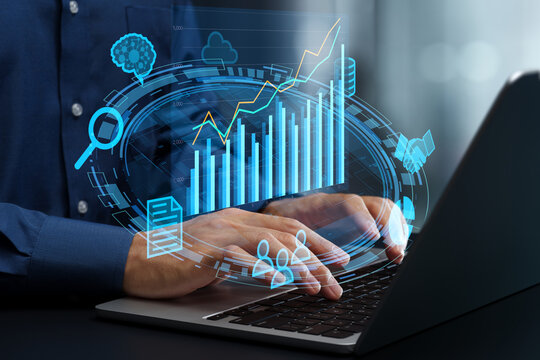 Business data analysis. Automated BI and KPI visualization solution. Data driven decision making. Businessman using laptop computer to view analytics graph.