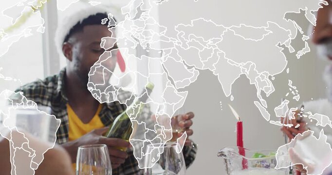 Host reaching bottle, pouring wine at table for dining toast, world map overlay fading over scene