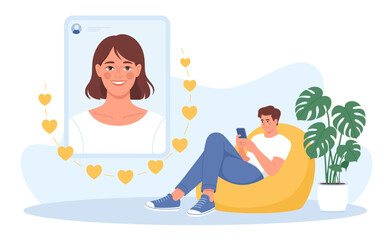 A cheerful young man engages with a phone, connecting with someone special as hearts surround a digital image, representing love and modern relationships in digital times.