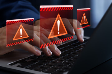 Warning alert windows from security system or software. Application problem or issue. Businessperson using laptop computer with error message.