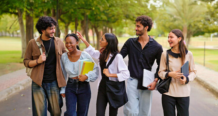 Indian happy young adult gen z walk female male man guys talk gossip share new day plan enjoy break time outdoor place. Happy pupil teen age girl boy group speak funny joke have fun joy park