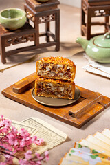 A mooncake is a traditional Chinese pastry that is typically eaten and gifted during the Mid-Autumn Festival, one of the biggest cultural celebrations in East and Southeast Asia