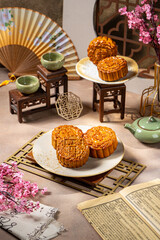 A mooncake is a traditional Chinese pastry that is typically eaten and gifted during the Mid-Autumn Festival, one of the biggest cultural celebrations in East and Southeast Asia