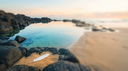 Coastal rock pool at dawn with turquoise water reflecting the pale sky and basalt stones
