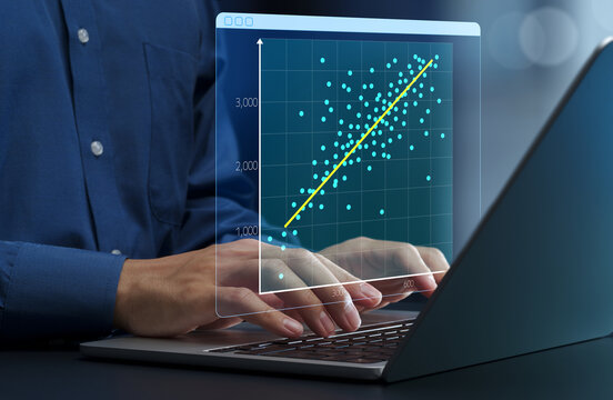 Regression analysis. Linear regression chart. Predicting trends with historical business data. Businessperson using laptop computer to make data-driven decisions.