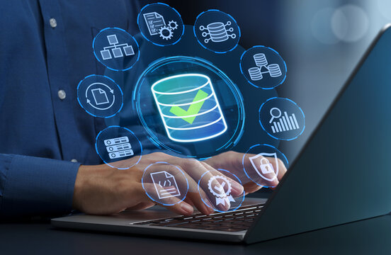 Data management and governance. Data quality and integrity strategies. Data integration and migration. Businessperson using laptop computer.