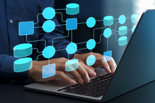 Data flow and process analysis. Data flow diagram. Visualization of system and information. Engineer using laptop computer to manage data processing system.