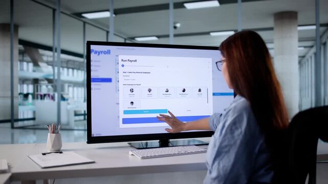 Salary Payment System: Woman Calculating Payroll