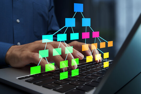 Data structure and tree diagram. Programmer using laptop computer to develop software.
