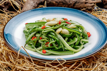 Stir-fried cucumber strips with chili and garlic