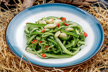 Stir-fried cucumber strips with chili and garlic