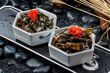 Spicy kelp knots and seaweed served in exquisite porcelain tableware