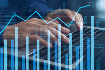 Data analytics. Graphs and charts. Business intelligence and web marketing data analysis. Data scientist using laptop computer to analyze statistical data.