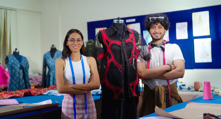 Indian young adult gen z male man female wear tape around cross arms look camera standing at class room happy teen boy girl fold hand staring cam do pose learn new cloth craft course day college place