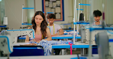 Indian young adult pupil gen z woman wear measure tape around neck sitting class room learn new...