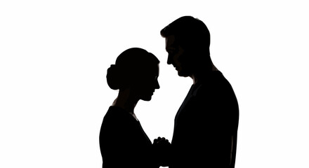 Silhouette of a couple in a tender embrace, showing love and connection.