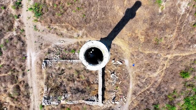 Drone shot of the abandoned mosque minaret in the dried-up lake
