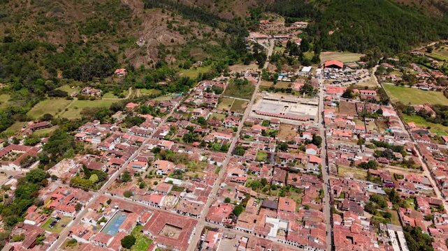 High angle and tilt down drone footage flying over the colonial town of villa de leyva in boyaca, colombia