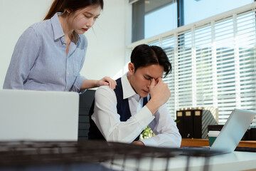 business people, teamwork, people and crisis concept - business team sitting sad and solving problems in the office.