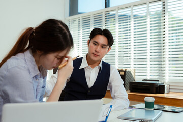 business people, teamwork, people and crisis concept - business team sitting sad and solving problems in the office.