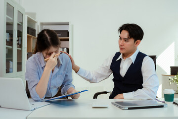 business people, teamwork, people and crisis concept - business team sitting sad and solving problems in the office.