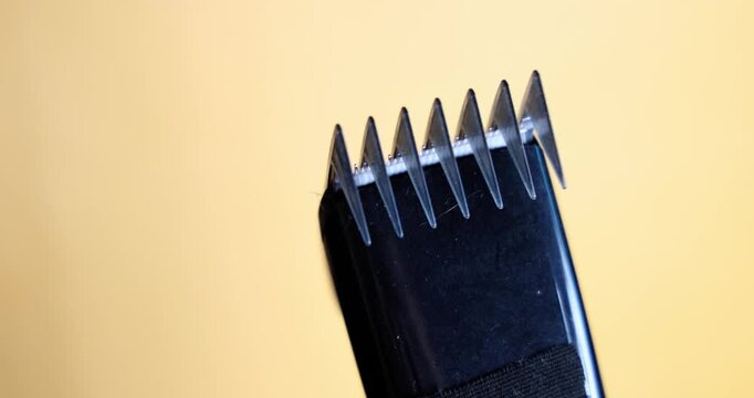 Close up shot of an electric shaver's comb guard operating. This footage highlights precision grooming and personal care. Perfect for beauty and technology concepts. 4K real time