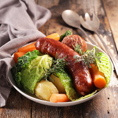 traditional dish with sausage, cabbage, carrot and potatoes
